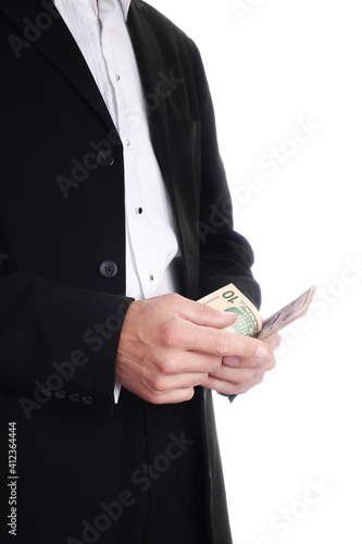 Business man holding money on white background