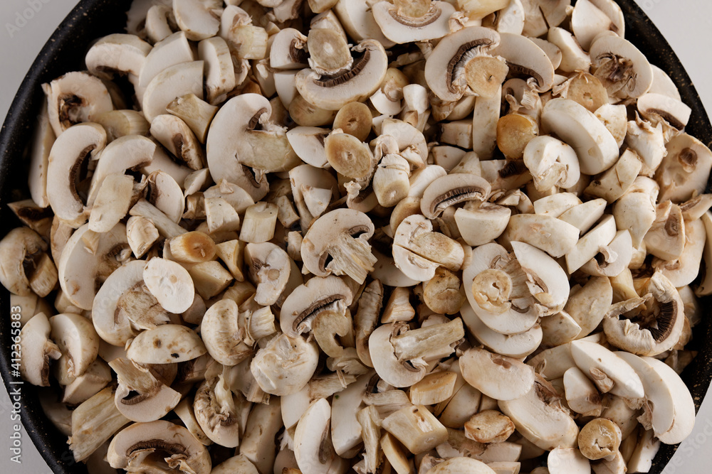 sliced fresh mushrooms in a pot sliced fresh mushrooms in a pot