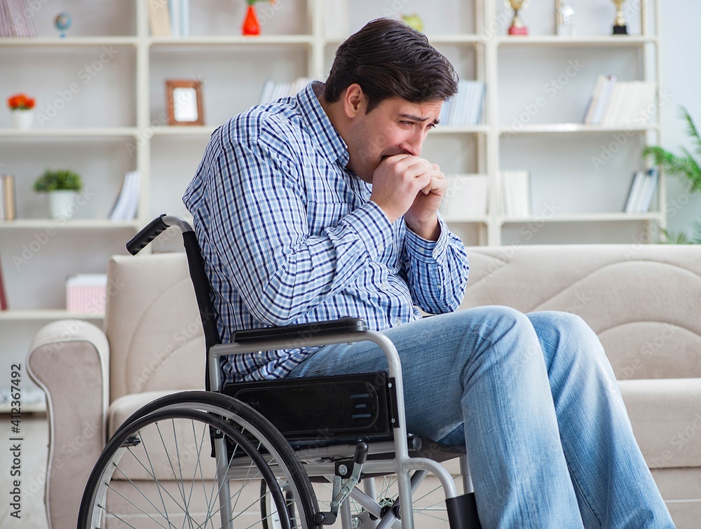 Disabled young man suffering at home Disabled young man suffering at home