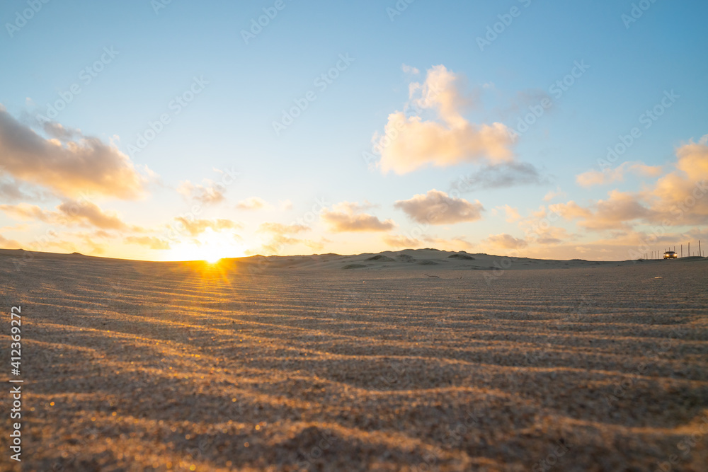 Sand dunes on the beach at sunset, California
