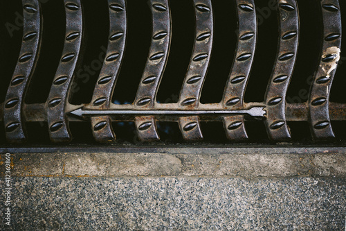 Arrows in street sewer cap.