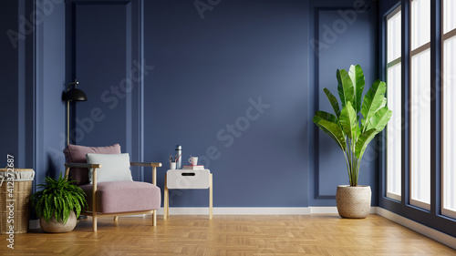 Fototapeta Naklejka Na Ścianę i Meble -  Interior of light room with armchair on empty dark blue wall background.