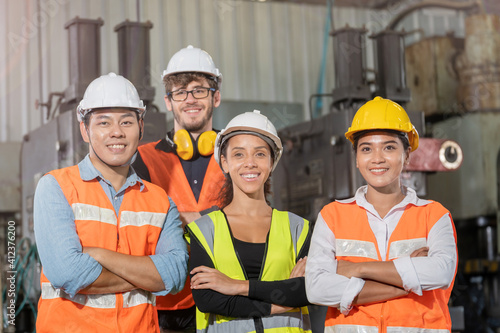 Fototapeta group worker factory men and women standing with confidence and success