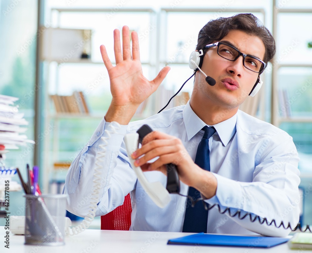Unhappy angry call center worker frustrated with workload Unhappy angry call center worker frustrated with workload