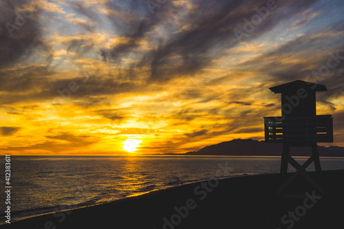 The ocean rescue lifeguard tower of the beach of Torre de Benagalbon  a coastal town of Andalucia in Spain at sunset
