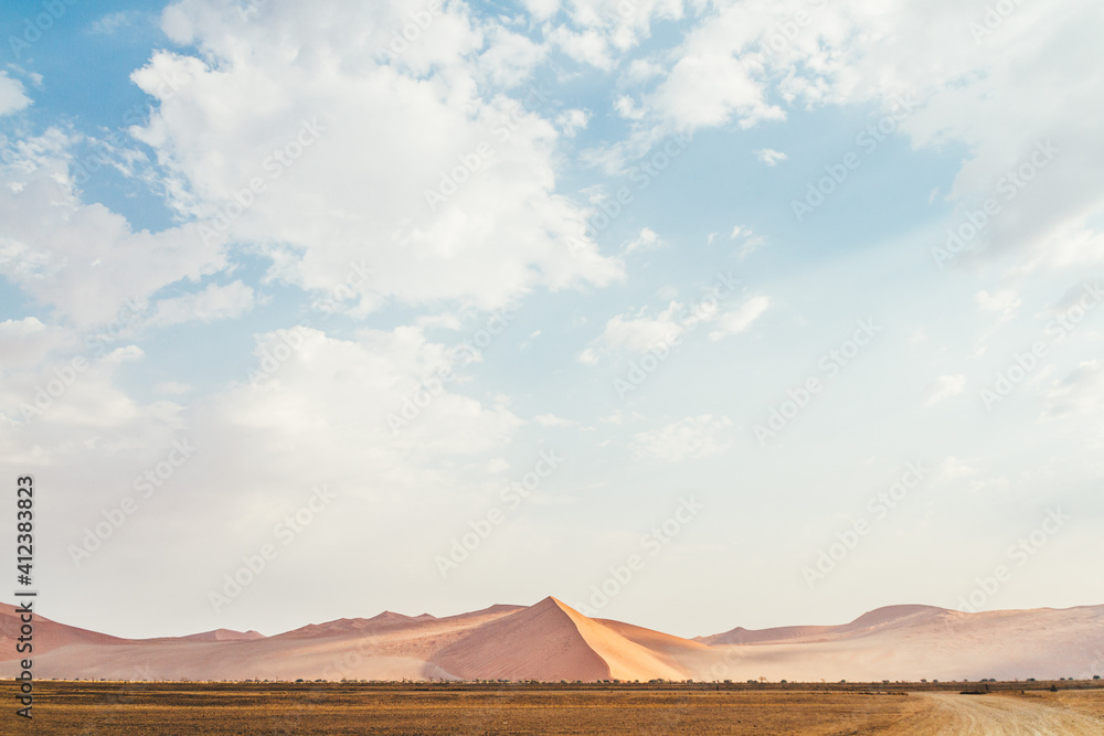 Sand dunes on the desert and blue sky. Sossusvlei, Namibia Sand dunes on the desert and blue sky. Sossusvlei, Namibia