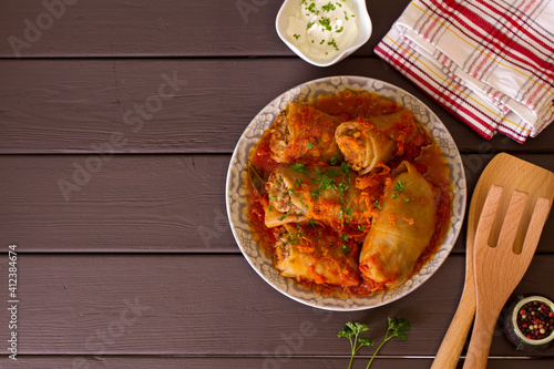 Cabbage rolls with meat, rice and vegetables. Chou farci, dolma, sarma, golubtsi or golabki. View from above, top view photo