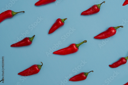 Red Chili Peppers On Blue photo