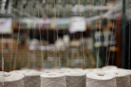 Close up of thread cones in a textile workshop photo