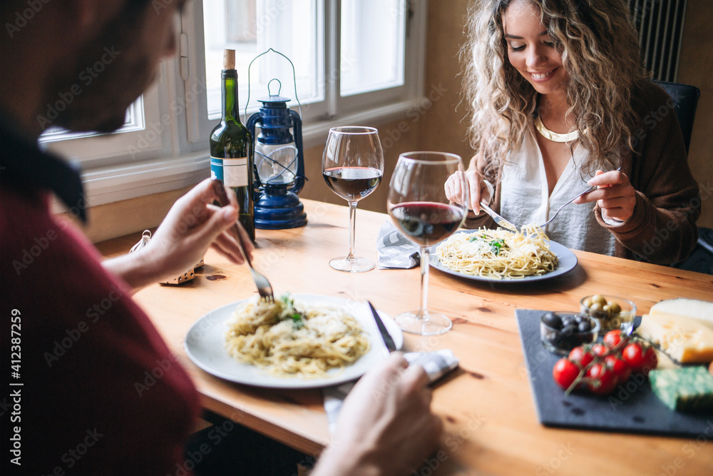 Caucasian Couple Eating Spaghetti With Red Wine Caucasian Couple Eating Spaghetti With Red Wine