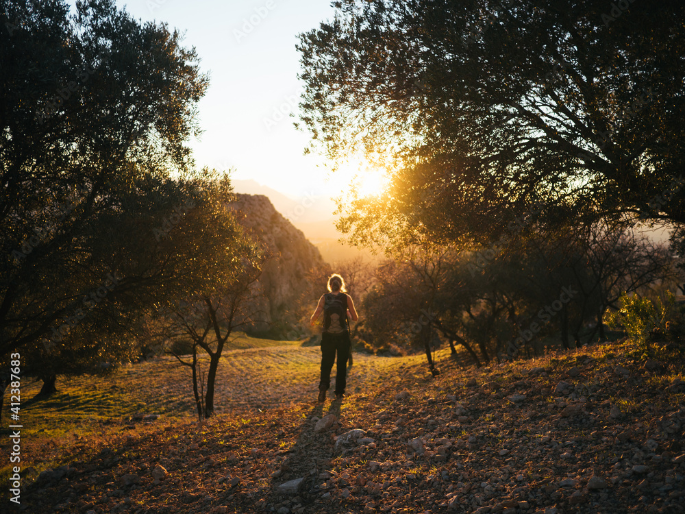 Girl hiking in el chorro mountains during sunset Girl hiking in el chorro mountains during sunset