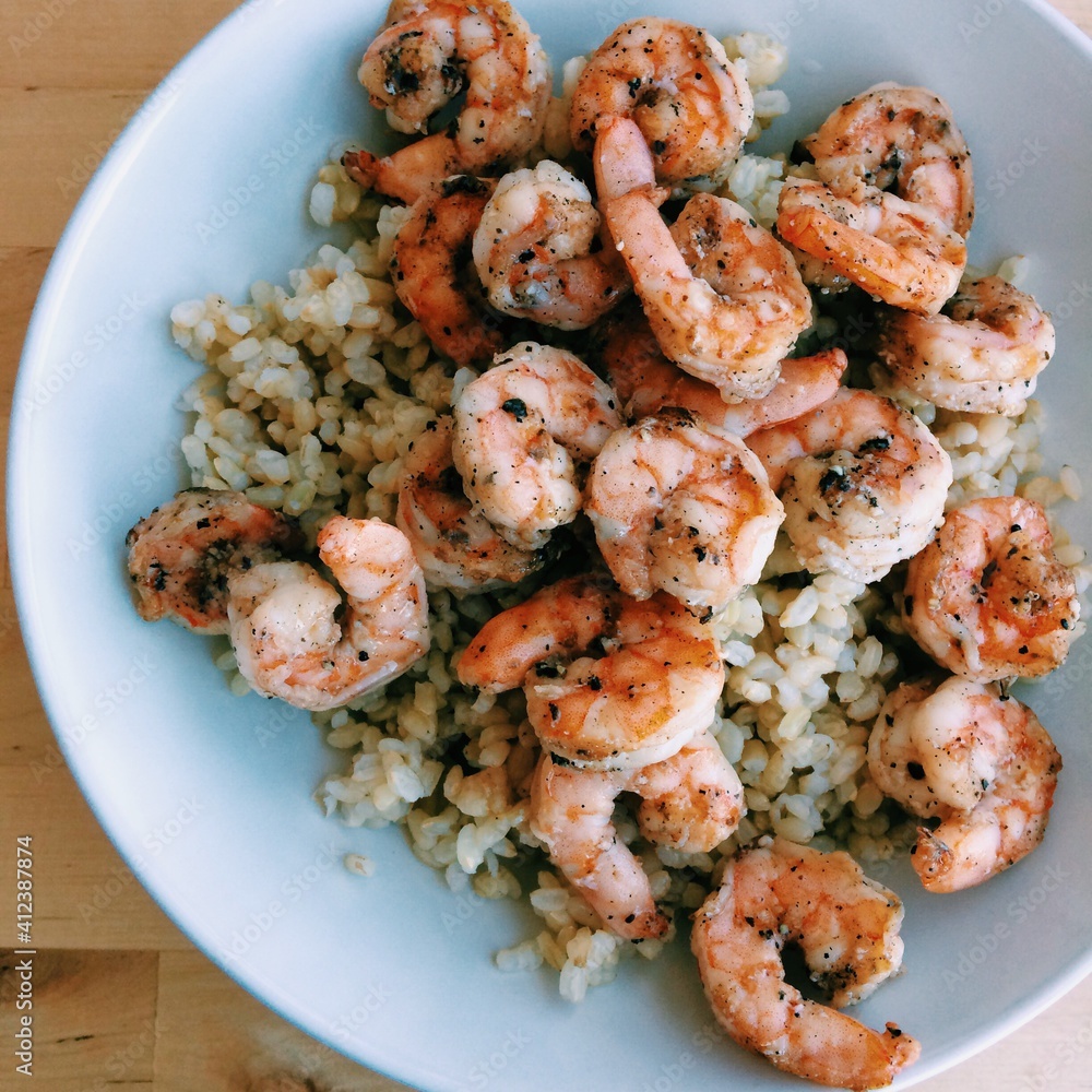 A bowl of grilled shrimp, prawns and brown rice A bowl of grilled shrimp, prawns and brown rice