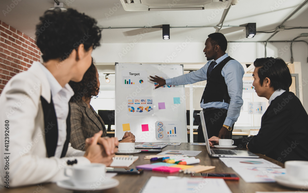African Americans are leading graph business meetings with people of diversity nationalities in office conference rooms. Concept Diversity meeting business room. African Americans are leading graph business meetings with people of diversity nationalities in office conference rooms. Concept Diversity meeting business room.
