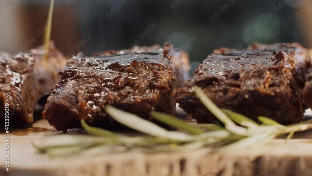 Tasty steak in fire. Delicious, roasted meat. American lunch served on wooden plate. Tasty steak in fire. Delicious, roasted meat. American lunch served on wooden plate.