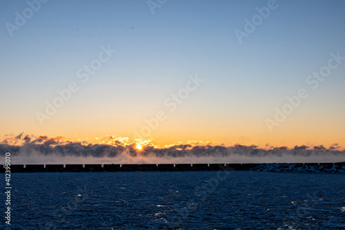 frigid sunrise over steaming lake © Patrick
