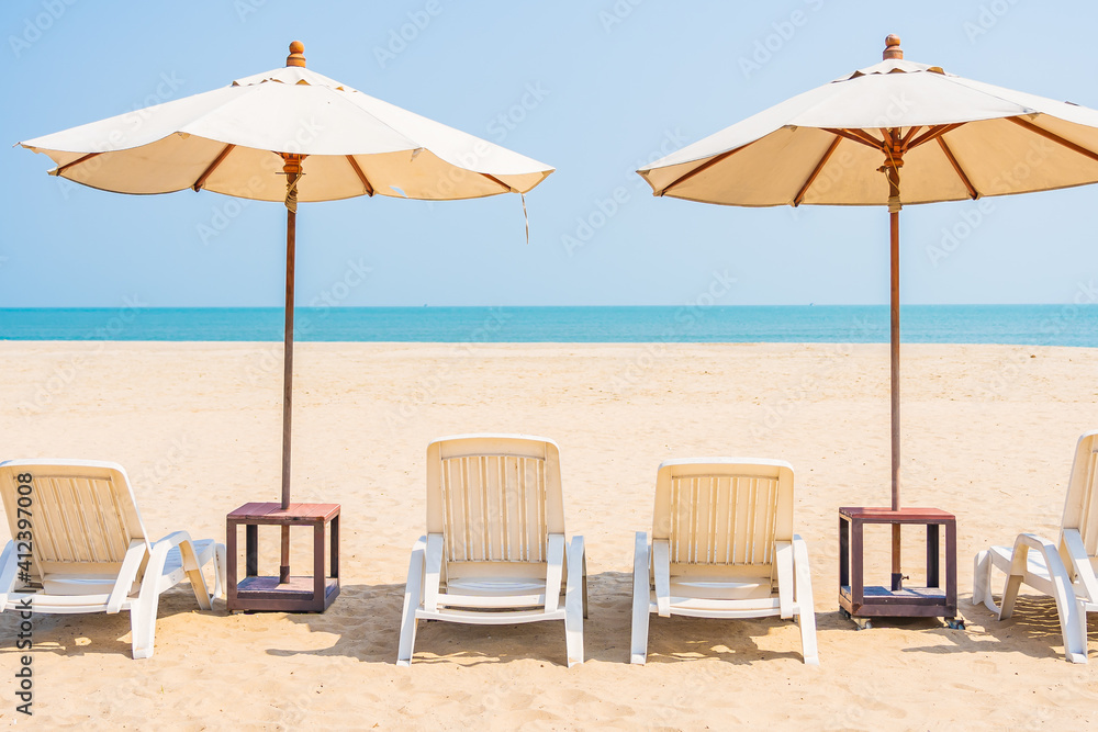 Umbrella and chair around beach sea ocean on blue sky