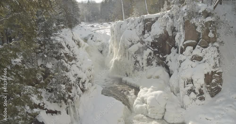 Beautiful waterfall in a snowy forest Beautiful waterfall in a snowy forest