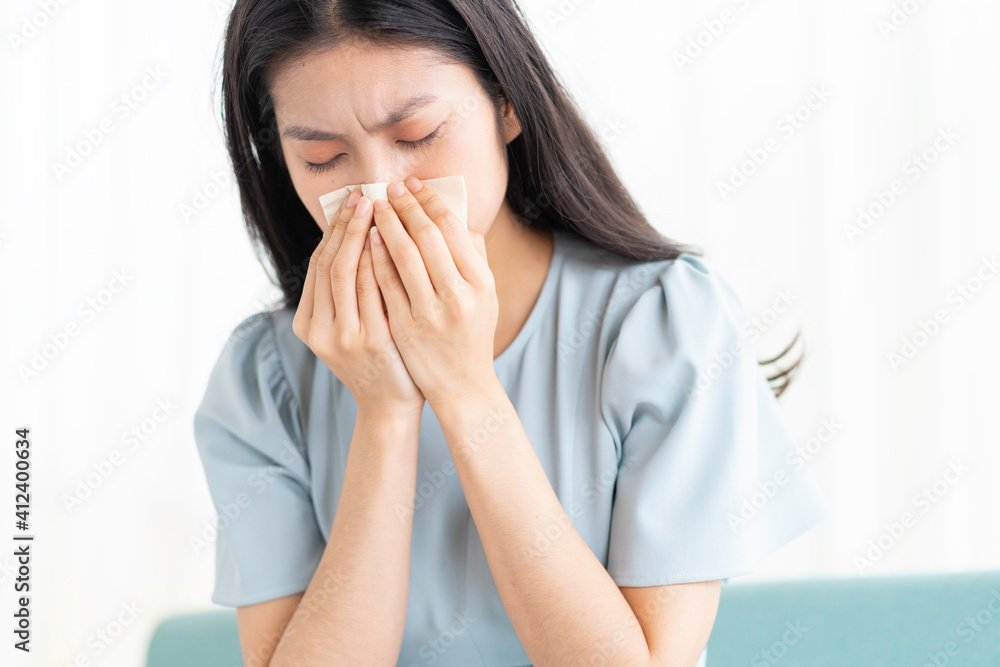 Young asian girl sitting on chair and feeling tired Young asian girl sitting on chair and feeling tired
