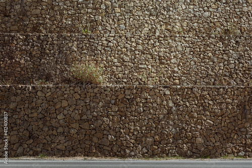 Stone wall and grass background