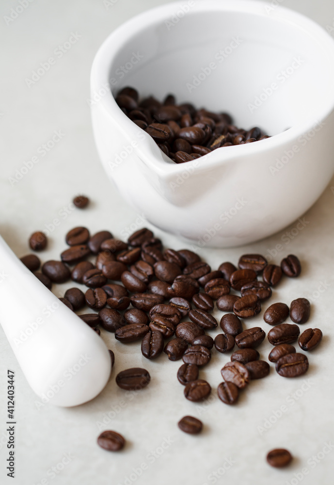 Coffee beans in a mortar