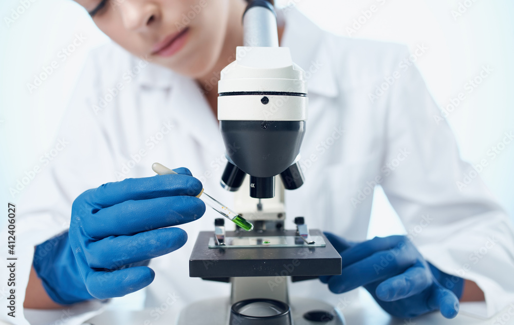 female doctor in medical gloves and in a white coat bacteria laboratory female doctor in medical gloves and in a white coat bacteria laboratory