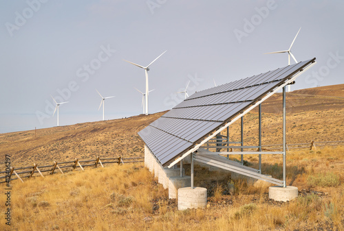 Wind Turbines and Solar Panel. Wind turbines and solar panels on an arrid field of grass in Washington State.

 photo