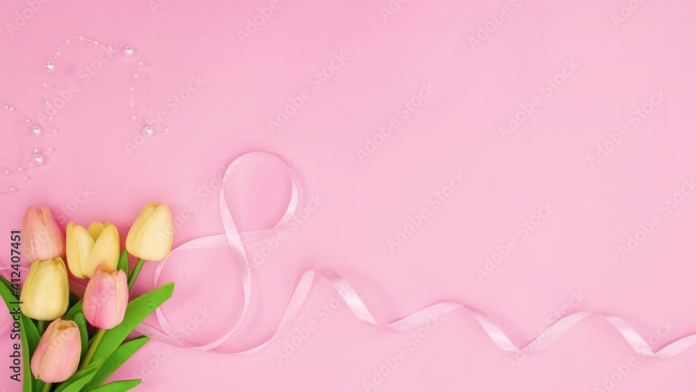 Romantic flowers, pearls and ribbons appear on pastel pink theme. Stop motion Romantic flowers, pearls and ribbons appear on pastel pink theme. Stop motion