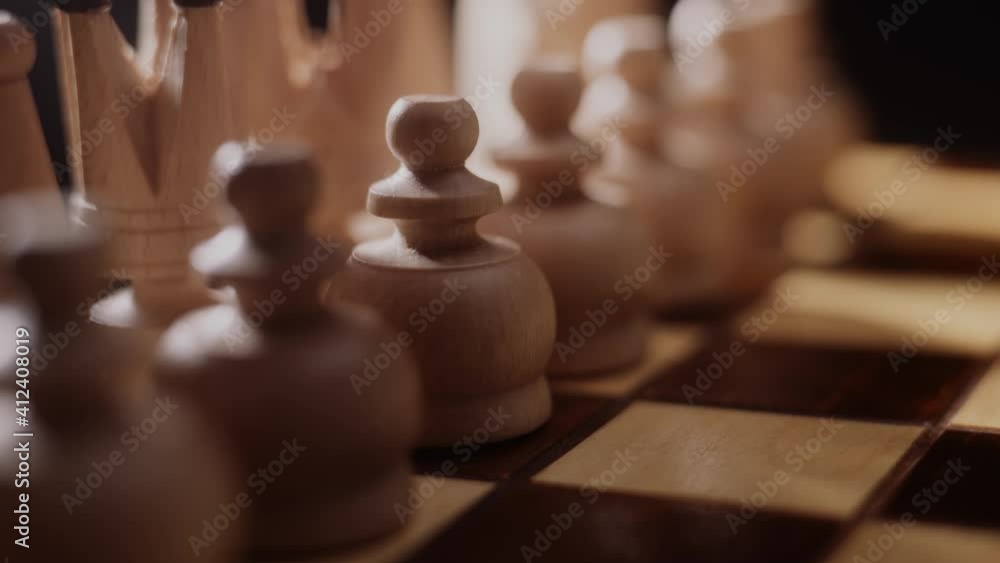 Woman playing chess, close up of lady's hand opening a game of chess. Pawn move, strategy and concentration concept. Challenge, preparation and success. Woman playing chess, close up of lady's hand opening a game of chess. Pawn move, strategy and concentration concept. Challenge, preparation and success.