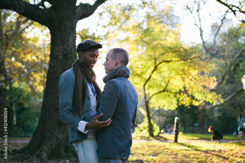 Young Gay Couple in Intimate Moments in New York Central Park at Sunset photo