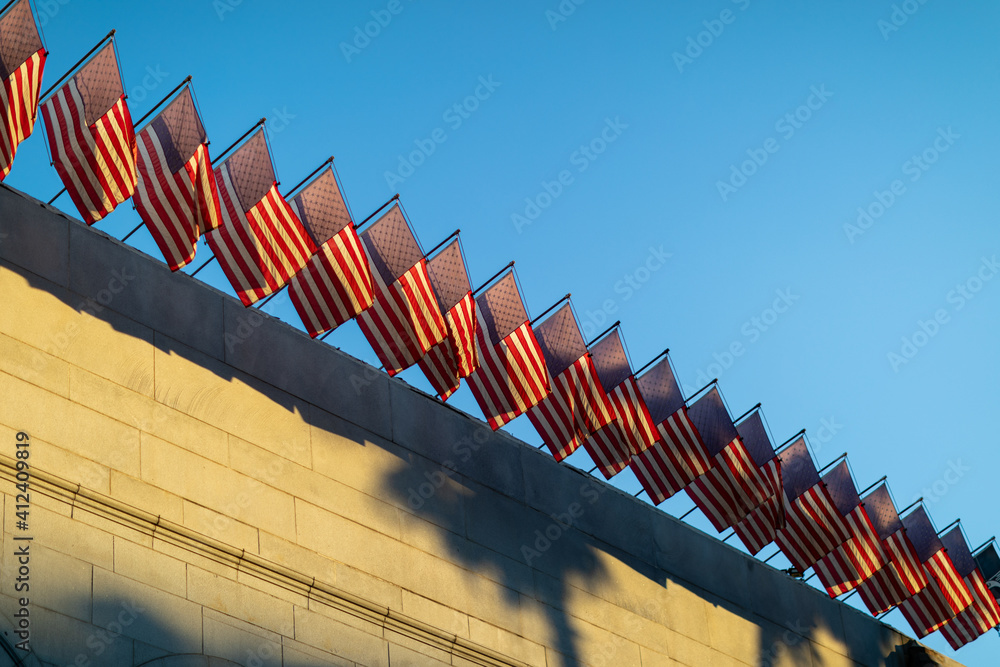 Fototapeta premium American Flags during sunset