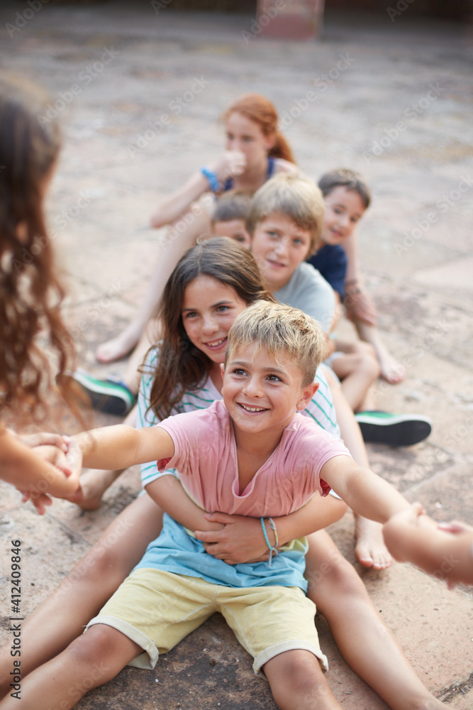 Group of children playing together a game of strength Group of children playing together a game of strength