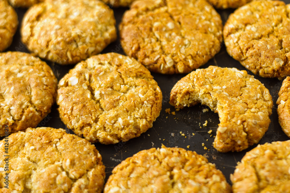 ANZAC biscuits oat cookies one bitten ANZAC biscuits oat cookies one bitten