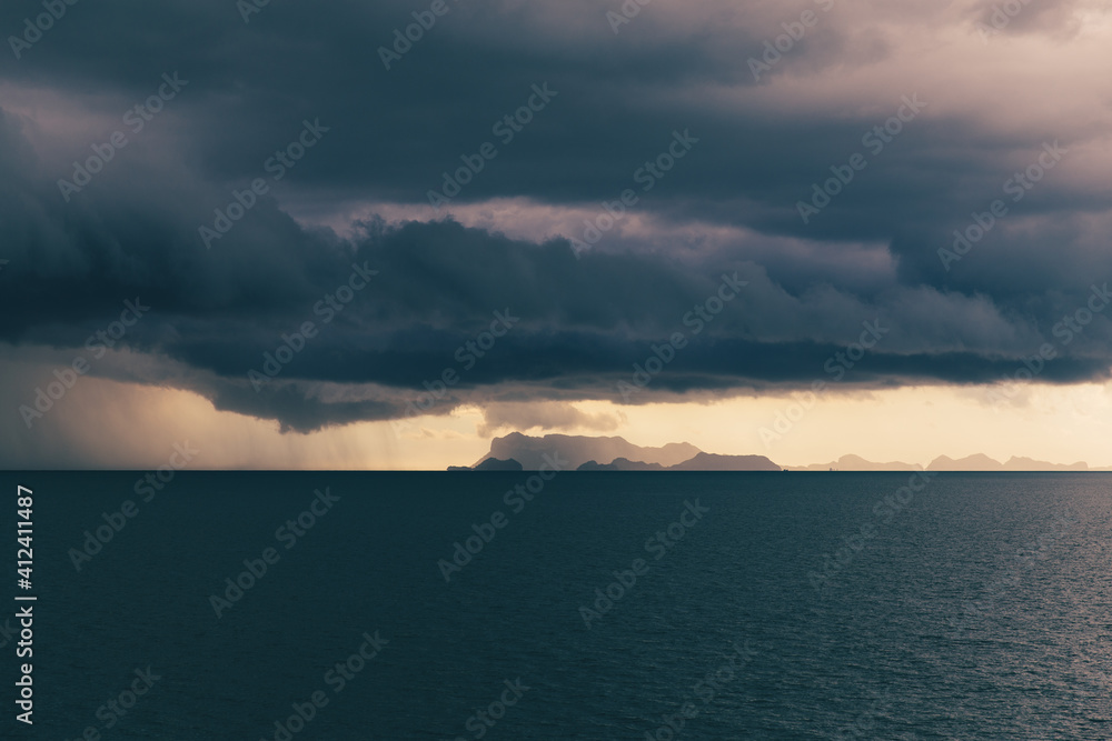 Beautiful photo of storm clouds above the dark blue ocean Beautiful photo of storm clouds above the dark blue ocean