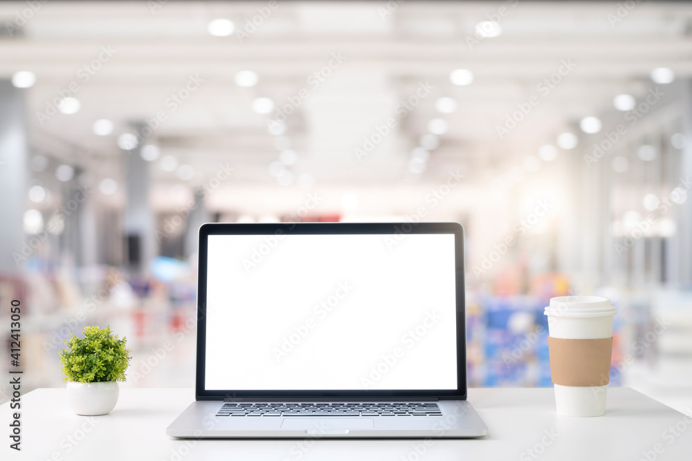mockup, laptop on a white table and a blurred background mockup, laptop on a white table and a blurred background