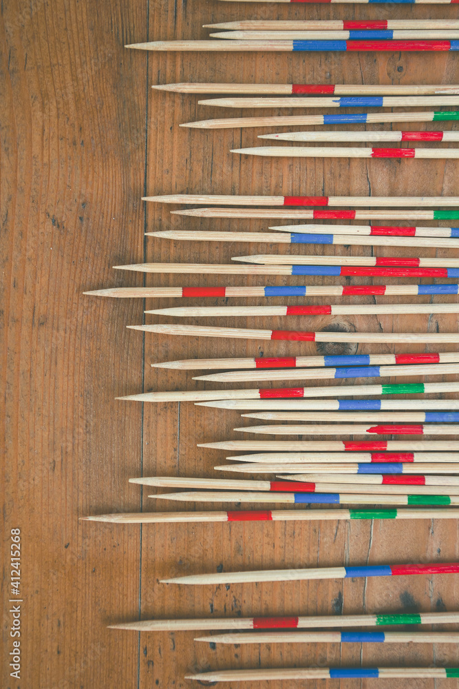 Mikado game. Colorful wood sticks on old wooden background. Mikado game. Colorful wood sticks on old wooden background.