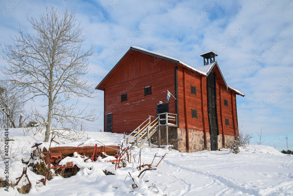 Winter view over a barn house on the Drottningholm island in Stockholm. 2021-01-10