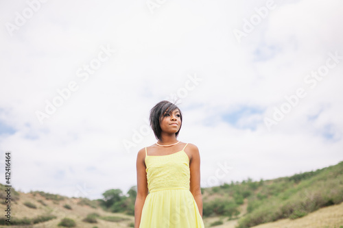 Wallpaper Mural Black girl outside in yellow dress Torontodigital.ca