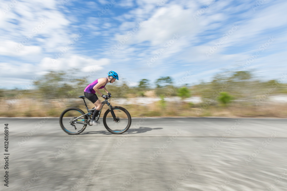 Female mountain biker riding the trails Female mountain biker riding the trails