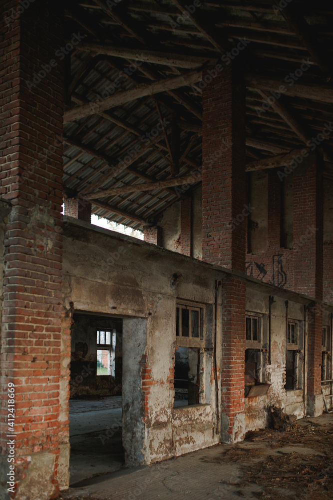 Door and windows under porch in abandoned antique italian farm