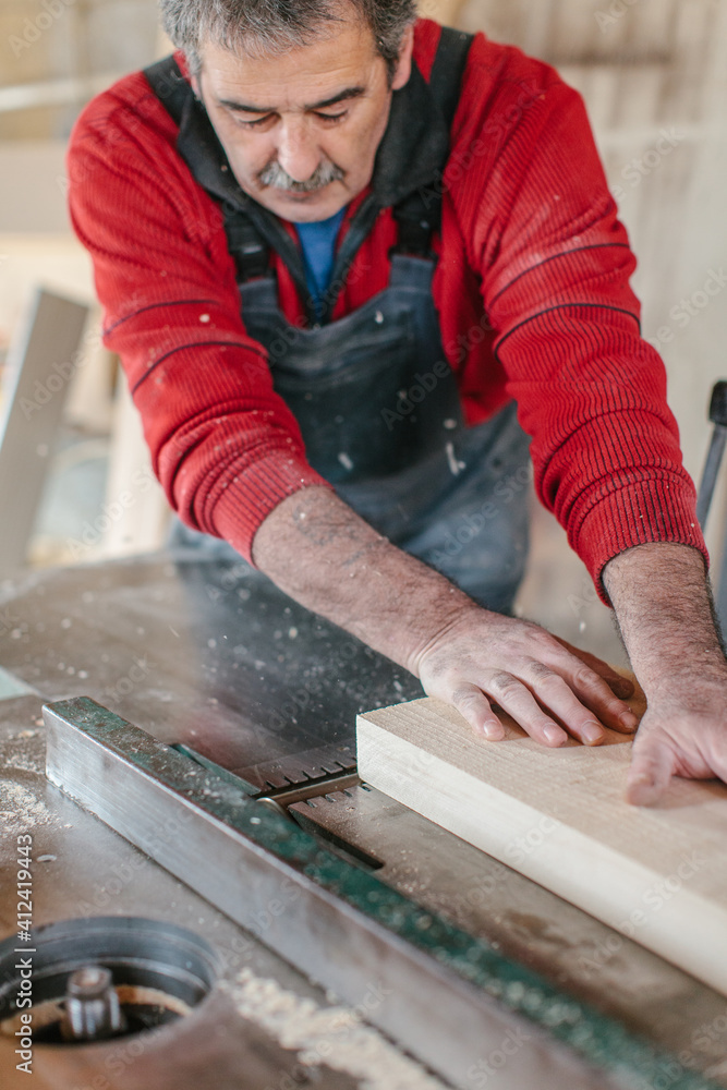 Carpenter working in his workshop Carpenter working in his workshop