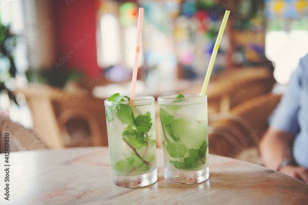 2 mojitos sitting on a table in a bar in Cuba 2 mojitos sitting on a table in a bar in Cuba