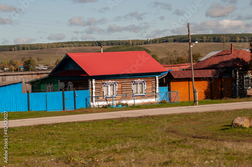 Wallpaper Mural Autumn sky over  village with small wood colored local house and low fence in the mountains and fields. Travelling on the suburb roads. People living Torontodigital.ca