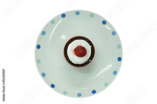 chocolate mousse with strawberries topping on white plate,  i…