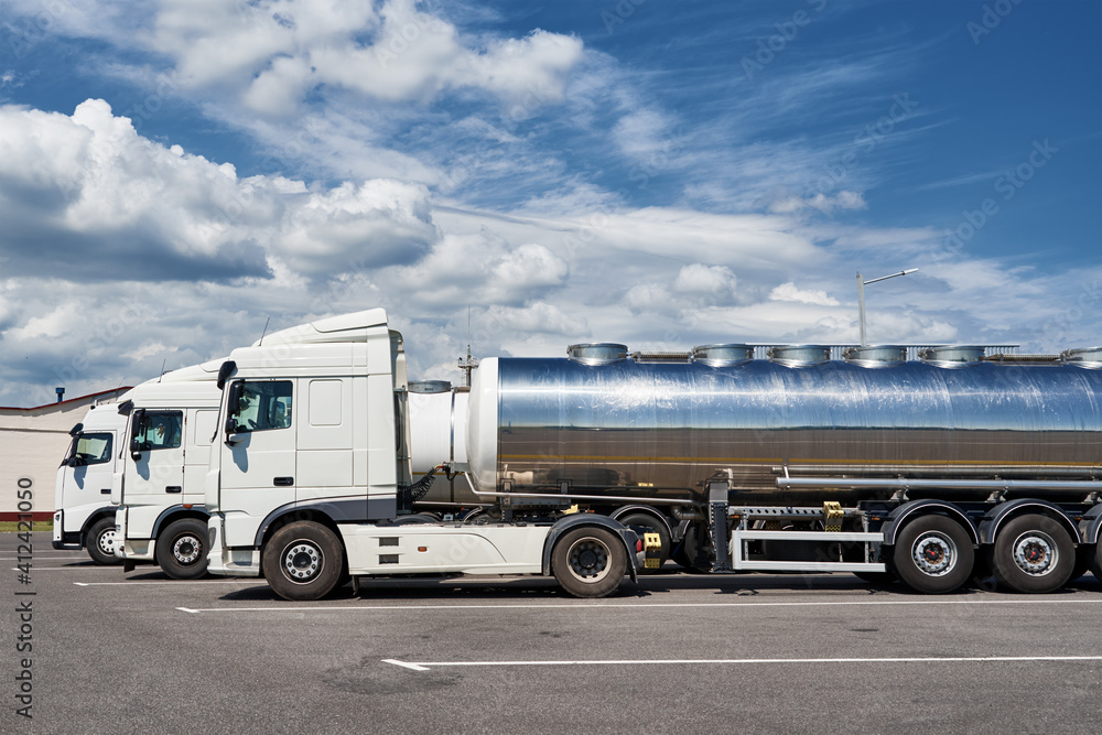 Trucks with tank trailer on parking lot Trucks with tank trailer on parking lot