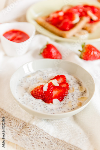 Chia pudding with strawberries and almonds photo