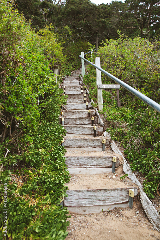 Stairs on the beach leading to a private property in Portsea, Victoria, Australia Stairs on the beach leading to a private property in Portsea, Victoria, Australia