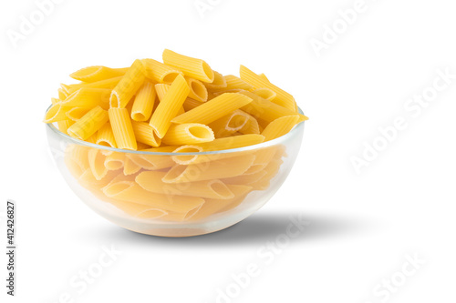 Raw organic pasta in a glass bowl isolated on a white background