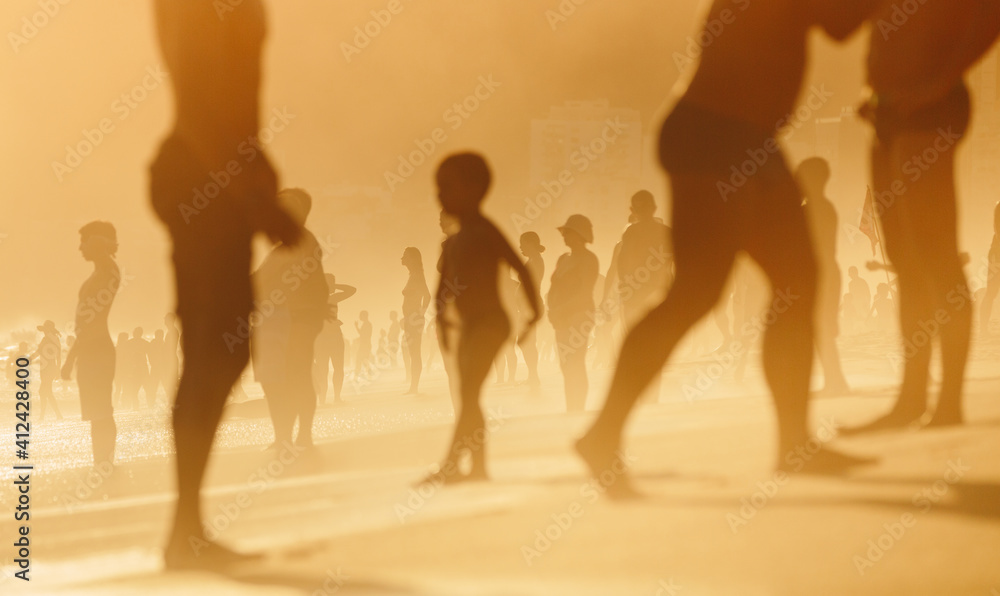 A group of beach goers enjoy the last bit of hazy summer sun in Rio De Janeiro, Brazil A group of beach goers enjoy the last bit of hazy summer sun in Rio De Janeiro, Brazil
