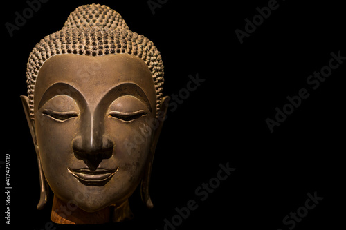 Ancient Buddha Face isolated on black background