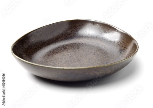 Billede på lærred Empty earthenware plate on white background